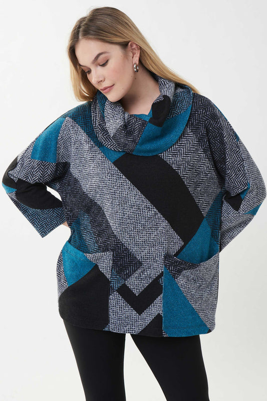 superbe chandail  imprimer dans les tons de noir,bleu sarcelle,et de gris pale...coupe décontracté. un grand col et ses belles poches avant donne un super look a ce chandail. Signé Joseph Ribkoff