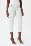 Pantalon blanc imprimé pour femme de Joseph Ribkoff, au style original . Coupe courte, sans poches, taille élastique, Fait de 76% Viscose Rayon, 21% Nylon, 3% Spandex